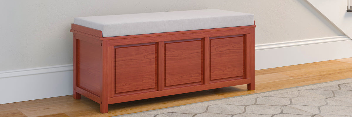 red mahogany open top storage bench with closed lid placed in stairway hall