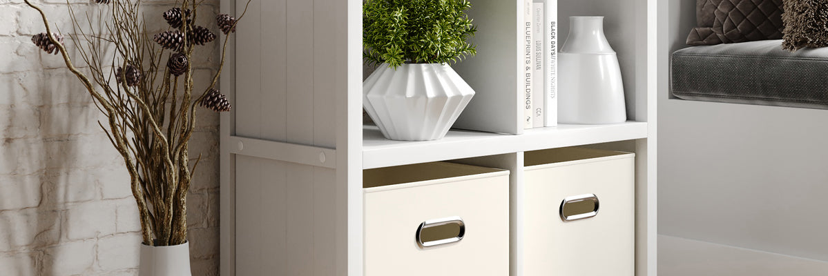 close up of a white 4 cube organizer displaying items in a hearth room